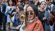 Fashion blogger Chriselle Lim poses prior to the Balmain women's 2018 Spring/Summer ready-to-wear collection fashion show in Paris, on September 28, 2017. AFP / STRINGER
