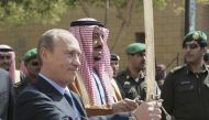 (FILE) Russian President Vladimir Putin and Prince Salman bin Abdul Aziz, then governor of Riyadh and now king of Saudi Arabia, hold swords on a visit to King Abdul Aziz Historical Center in Riyadh in 2007. Photo: Reuters/Itar-Tass