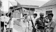 A Chinese student is attacked amid a purge in Jakarta in 1965 (Photo courtesy:  SCMP) 