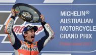 Honda rider Marc Marquez of Spain celebrates his victory on the podium at the end of the Australian MotoGP Grand Prix at Phillip Island on October 22, 2017. AFP / PETER PARKS