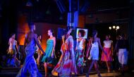 Cuban models walk on stage during the opening of the Havana Fashion Week, on October 25, 2017. AFP / Adalberto Roque