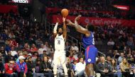 Memphis Grizzlies guard Mike Conley (11) shoots the ball over Los Angeles Clippers center DeAndre Jordan (6) during the first quarter of an NBA game at Staples Center. Kiyoshi Mio