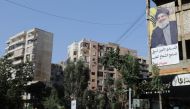 A picture taken on November 5, 2017 shows a banner bearing a portrait of Lebanon's Hezbollah chief Hasan Nasrallah in the capital Beirut. / AFP / ANWAR AMRO
