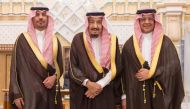 Saudi King Salman bin Abdulaziz Al Saud poses for a photo with National Guard Minister Khaled bin Ayyaf and Economy Minister Mohammed al-Tuwaijri during a swearing-in ceremony in Riyadh, Saudi Arabia, November 6, 2017. Saudi Press Agency/Handout via Reute