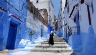 A Moroccan woman walks in Chefchaouen, in the northern Moroccan Rif region during the Muslim holy fasting month of Ramadan on June 21, 2017. AFP / EMILY IRVING-SWIFT
