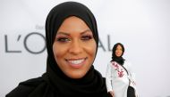 Olympic fencer Ibtihaj Muhammad holds a Barbie doll made in her likeness as she attends the 2017 Glamour Women of the Year Awards at the Kings Theater in Brooklyn, New York, U.S., November 13, 2017. REUTERS/Andrew Kelly