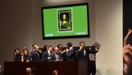 Christie's employees take bids for Leonardo da Vinci's 