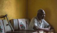 In this photograph taken on November 23, 2017, 93 year-old Zimbabwean Johannes sits on a chair in his home as he speaks about growing up with former Zimbabwean President Robert Mugabe in the village of Kutama some 200kms west of Harare.  AFP / Mujahid Saf