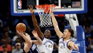 Orlando Magic guard Mario Hezonja (8) shoots over Golden State Warriors forward Draymond Green (23) and guard Klay Thompson (11) during the second quarter at Amway Center. Kim Klement
