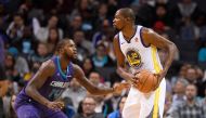 Golden State Warriors forward Kevin Durant (35) tries to pass against Charlotte Hornets forward Michael Kidd-Gilchrist (14) during the second half at the Spectrum Center. Sam Sharpe
