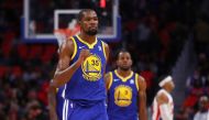 Kevin Durant #35 of the Golden State Warriors reacts to two three made free throws in the fourth quarter while playing the Detroit Pistons at Little Caesars Arena on December 8, 2017 in Detroit, Michigan.   Gregory Shamus/AFP
