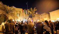 Kuwaitis and Palestinians gather outside the Palestinian embassy in Kuwait city on December 9, 2017, to demonstrate against the US president's controversial recognition of Jerusalem as Israel's capital. (AFP / Yasser Al-Zayyat)
