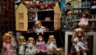 A picture shows dolls and a doll house at the Doll Hospital in Lisbon on December 12, 2017. AFP / PATRICIA DE MELO MOREIRA 