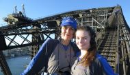 Brigid Schulte, left, and her daughter, Tessa Bowman, near the top of the Sydney Harbor Bridge, the tallest steel-arch bridge in the world. Bridge Climb photo
