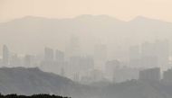 This picture taken on December 14, 2017 shows a general view of buildings seen from Hong Kong's highest peak Tai Mo Shan. AFP / Anthony Wallace 