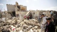 (FILE PHOTO) People inspect damage at a house after it was destroyed by an air strike in Yemen's capital Sanaa, February 25, 2016. REUTERS/Mohamed al-Sayaghi