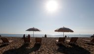 People sunbathe on a hot day in Barceloneta beach in Barcelona, Spain, Oct. 15, 2017. REUTERS/Gonzalo Fuentes/File Photo
