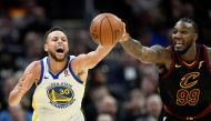 Golden State Warriors guard Stephen Curry (30) and Cleveland Cavaliers forward Jae Crowder (99) chase a loose ball in the second quarter at Quicken Loans Arena. David Richard