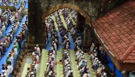 Muslims offer prayers on the last Friday of the holy month of Ramadan outside the Bandra railway station in Mumbai, on July 1, 2016. (AFP) 