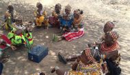 Members of the Kargi savings group hold a meeting in Marsabit County, Kenya, on November 30, 2017. Thomson Reuters Foundation/Benson Rioba