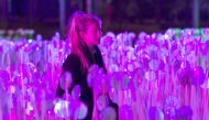 A visitor looks at a light installation during the Lumiere Festival 2018 in London, yesterday.