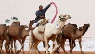 A man cheers as he rides a camel during King Abdulaziz Camel Festival in Rimah Governorate, north-east of Riyadh, Saudi Arabia January 19, 2018. Reuters/Faisal Al Nasser