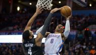 Brooklyn Nets center Jahlil Okafor (4) blocks a shot attempt by Oklahoma City Thunder guard Russell Westbrook (0) during the second quarter at Chesapeake Energy Arena. Mark D. Smith
