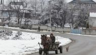 A horse-drawn carriage is pictured on a street in Dragomiresti, Dambovita county, Romania, January 23, 2018.  Inquam Photos/Octav Ganea via Reuters

