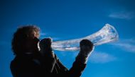 Terje Lsungset, the founder and artistic director of the Ice Music Festival, tests a musical instrument made of ice outside his workshop ahead of the festival on February 2, 2018 in the small mountain village of Finse in the municipality of Ulvik in south