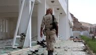 A fighter from the separatist Southern Transitional Council gathers on February 25, 2018, at the site of two suicide car bombings in the southern Yemeni port of Aden. AFP / SALEH AL-OBEIDI