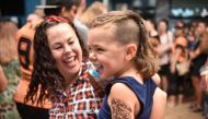 A child sports a mullet haircut at Mulletfest 2018 in the town of Kurri Kurri, 150 kms north of Sydney on February 24, 2018. AFP / PETER PARKS