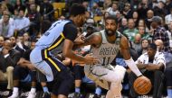 Boston Celtics guard Kyrie Irving (11) controls the ball against Memphis Grizzlies guard Andrew Harrison (5) during the second half at TD Garden.  Bob DeChiara 
