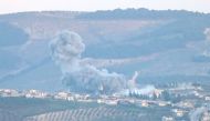 A photo taken from Turkey's Hatay province, on February 27, 2018 shows smoke rises after warplanes of Turkish Army Forces hit positions of PYD/PKK and Daesh terror groups across Hatay district within the 'Operation Olive Branch' launched in Syria's Afrin.