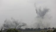 Smoke billows during fighting between Turkish-led forces and Syrian Kurdish fighters, on the outskirts of the town of Jandairis, in the region of Afrin, near the Turkish border on March 7, 2018.  AFP / OMAR HAJ KADOUR
