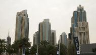 Flags for property company EMAAR are seen in front of buildings in Dubai, UAE March 7, 2016. REUTERS/Ahmed Jadallah
