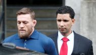 Mixed Martial Arts fighter Conor McGregor is escorted by New York City Police (NYPD) detectives from the 78th police precinct after charges were laid against him in the Brooklyn borough of New York City, U.S., April 6, 2018. Reuters/Brendan McDermid