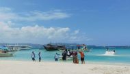 Tourists visit the beach on Boracay island, Aklan province, on April 6, 2018.  AFP / Ernesto Cruz