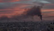 Smoke rises after Assad Regime carried out an airstrike at Douma town of Eastern Ghouta in Damascus, Syria on April 07, 2018. ( Mouneb Taim - Anadolu Agency )