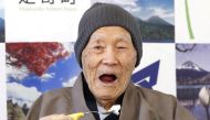 Japanese Masazo Nonaka, who was born 112 years and 259 days ago, eats his favorite cake as he receives a Guinness World Records certificate naming him the world's oldest man during a ceremony in Ashoro, on Japan's northern island of Hokkaido, in this phot