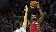 Miami Heat guard Dwyane Wade (3) shoots over Philadelphia 76ers guard Marco Belinelli (18) during the second quarter in game two of the first round of the 2018 NBA Playoffs at Wells Fargo Center.Bill Streicher
