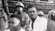 This November 01, 1960 photo shows soldiers guarding prime minister of then Congo-Kinshasa, Patrice Lumumba (R), and vice-president of the Senate, Joseph Okito, upon their arrest in Leopoldville (now Kinshasa).  AFP