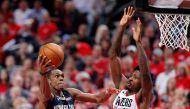 Rajon Rondo #9 of the New Orleans Pelicans drives against Ed Davis #17 of the Portland Trail Blazers during Game One of the Western Conference Quarterfinals during the 2018 NBA Playoffs at Moda Center on April 17, 2018 in Portland, Oregon. Jonathan Ferrey