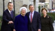 In this file photo taken on January 26, 2002 US President George W. Bush (2nd-R), his wife Laura (R), parents former US President George Herbert Walker Bush (L) and former first lady Barbara Bush (2nd L) as they leave St. John's Episcopal Church after Sun