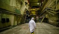 An employee walks through a pump room of the stopped third reactor at the Chernobyl nuclear power plant in Chernobyl, Ukraine April 20, 2018. Reuters/Gleb Garanich