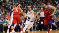 Shane Larkin #8 of the Boston Celtics drives to the basket past Dario Saric #9 of the Philadelphia 76ers during the second half of Game One in Round Two of the 2018 NBA Playoffs at TD Garden on April 30, 2018 in Boston, Massachusetts.   Maddie Meyer/ AFP 