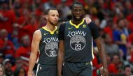 Stephen Curry #30 of the Golden State Warriors stands on the court with Draymond Green #23 of the Golden State Warriors during the first half of Game Four of the Western Conference Semifinals of the 2018 NBA Playoffs at the Smoothie King Center on May 6, 