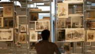 People take part in a nudist visit of the 'Discorde, Fille de la Nuit' season exhibition at the Palais de Tokyo museum in Paris on May 5, 2018. AFP / Geoffroy Van Der Hasselt