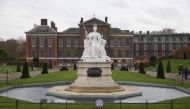 (FILES) In this file photo taken on November 27, 2017 A marble statue of Britain's Queen Victoria is pictured in the gardens of Kensington Palace in west London on November 27, 2017, following the announcement of the engagement of Britain's Prince Harry t