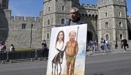 Artist Kaya Mar shows off his latest work in front of the castle in Windsor on May 17, 2018, two days before the royal wedding of Prince Harry and Meghan Markle. Britain's Prince Harry and US actress Meghan Markle will marry on May 19 at St George's Chape