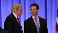 (FILE PHOTO) U.S. President Donald Trump speaks with his son Donald Trump Jr. in the lobby of Trump Tower in Manhattan, New York City, U.S., January 11, 2017. REUTERS/Lucas Jackson
